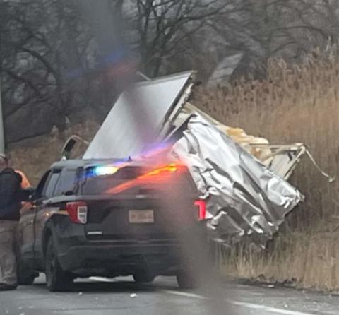 damaged truck in the ditch as seen by passing motorist